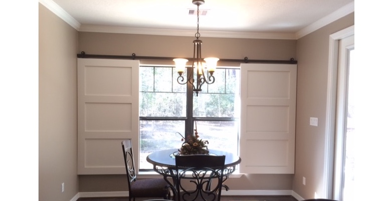 Barn doors open horizontally with slides instead of cords. Boston barn door shutters