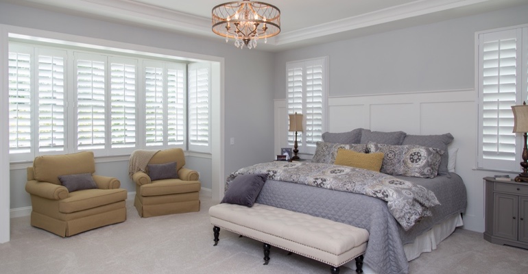 Plantation shutters in Boston bedroom.